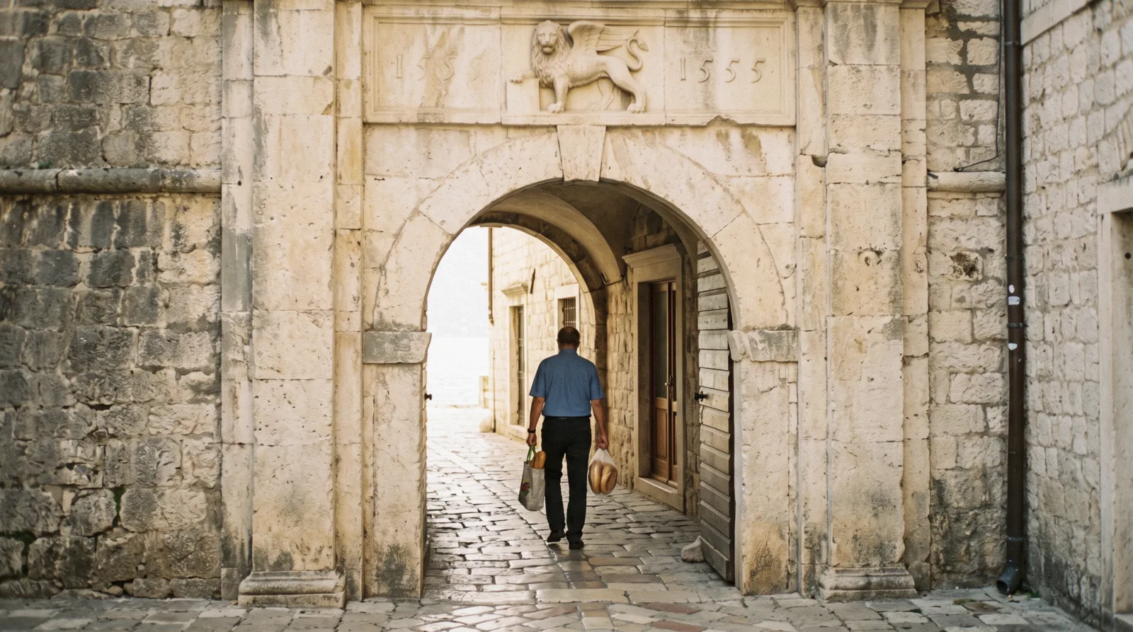 Stone lanes and squares of Kotor's old town seen on foot at ground level