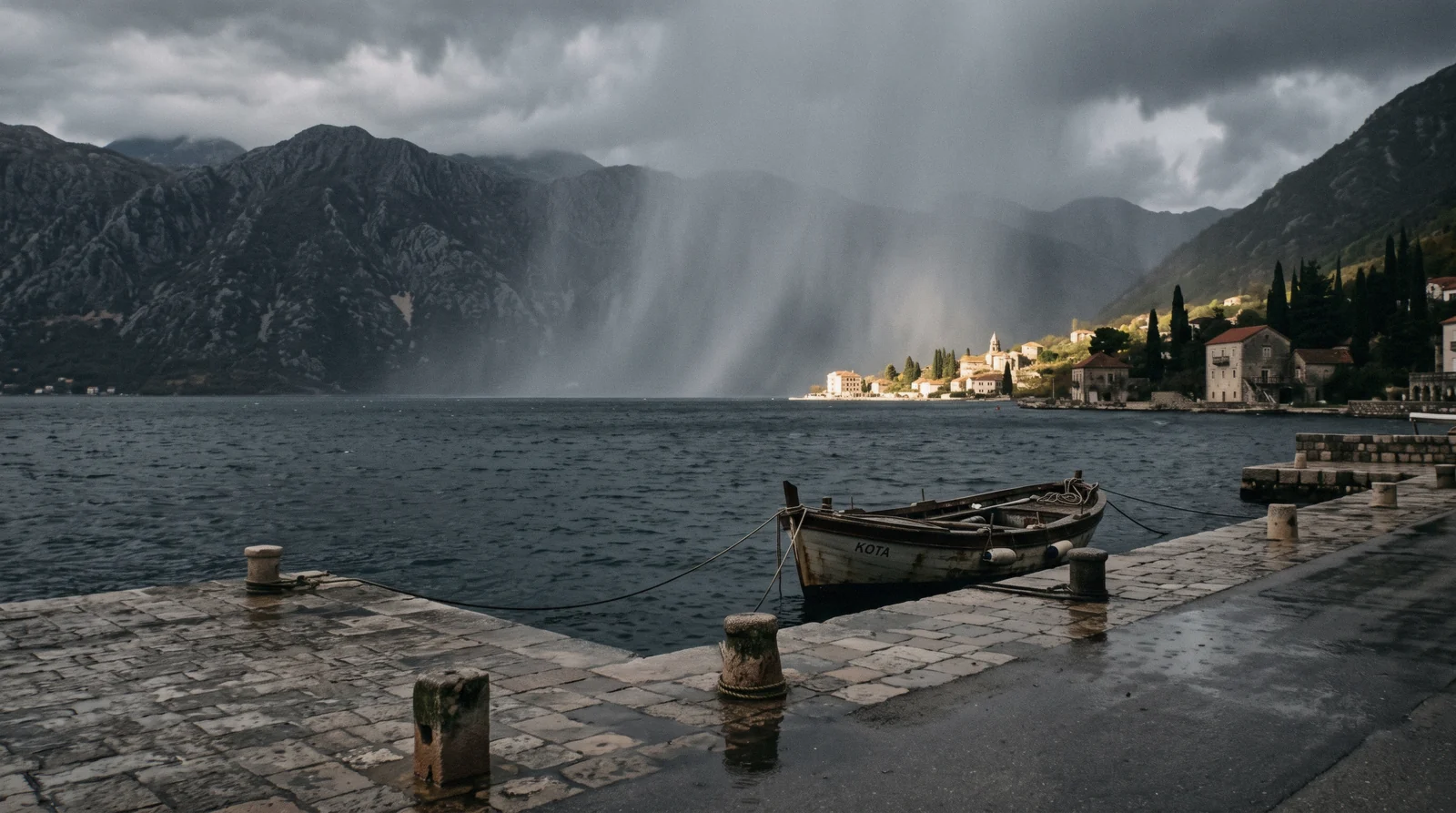 Low cloud over the Bay of Kotor with the walls of Kotor town below the mountains