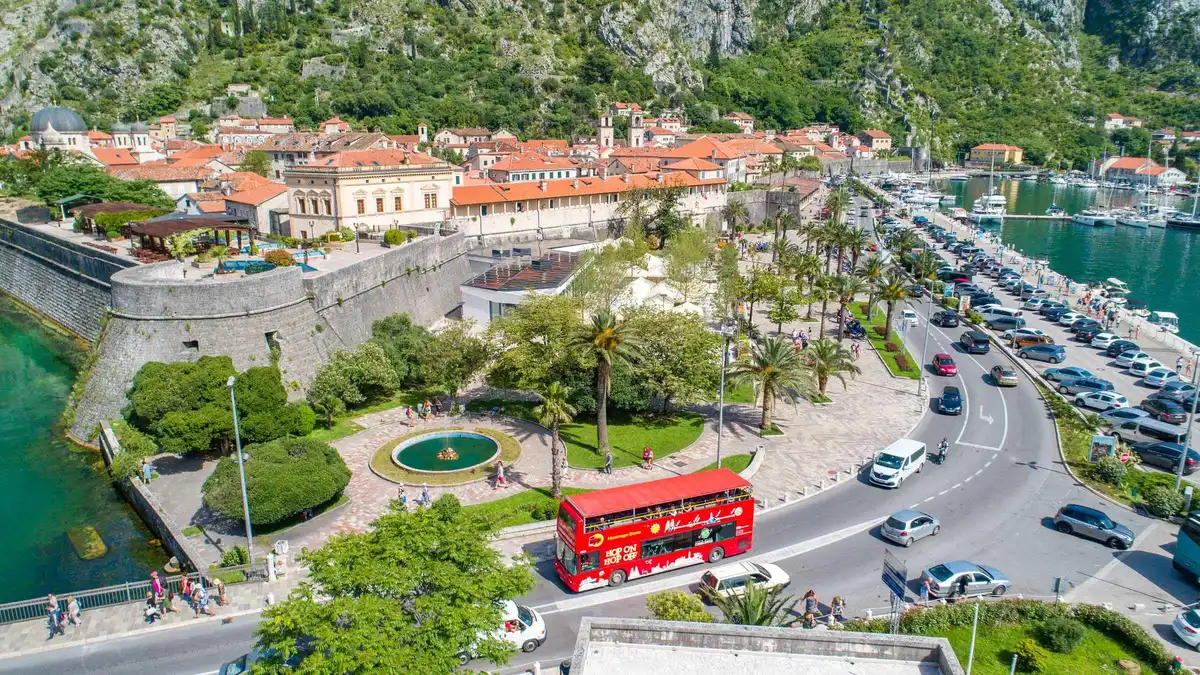 Hop-on hop-off sightseeing bus at a viewpoint above Kotor